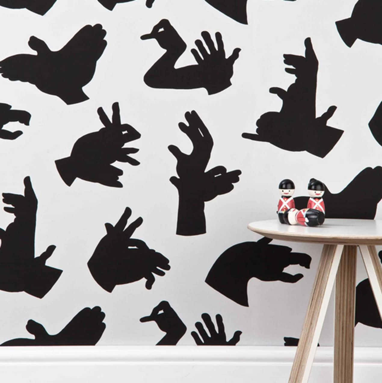 Wall With Atrocious Animal Shadows Wallpaper