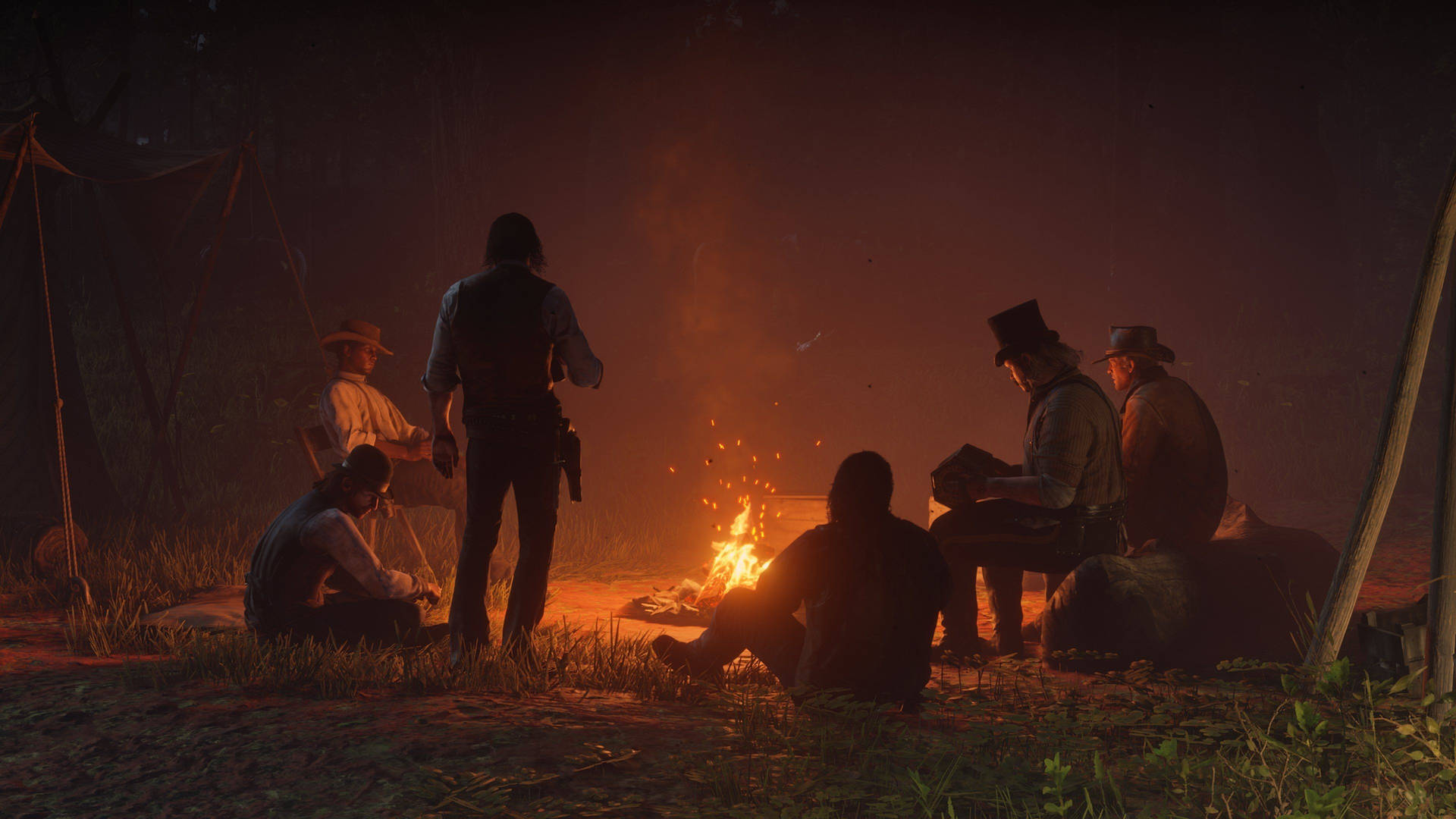 Enjoying a Warm Bonfire on the Open Plains During a Journey in Red Dead Redemption 2 Wallpaper