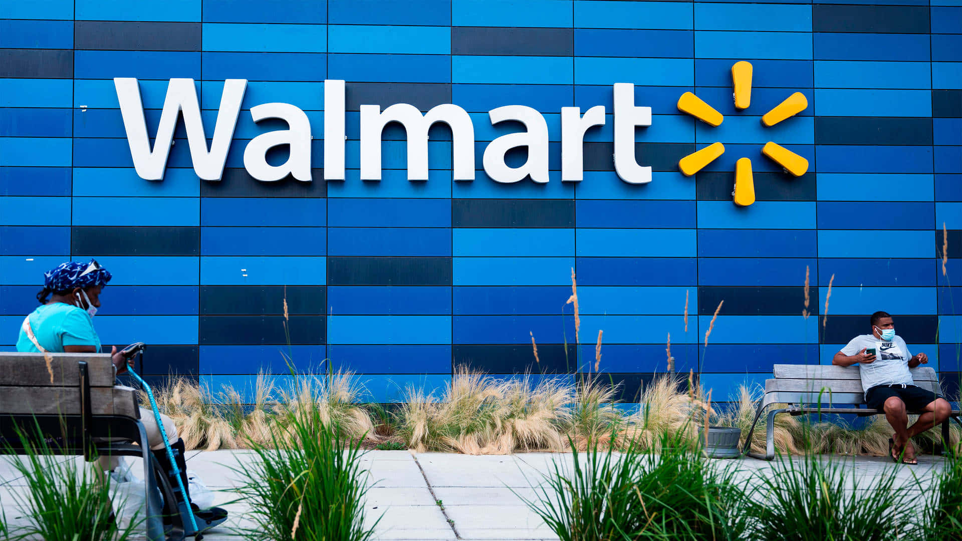 Walmart's New Logo Is Seen In The Background