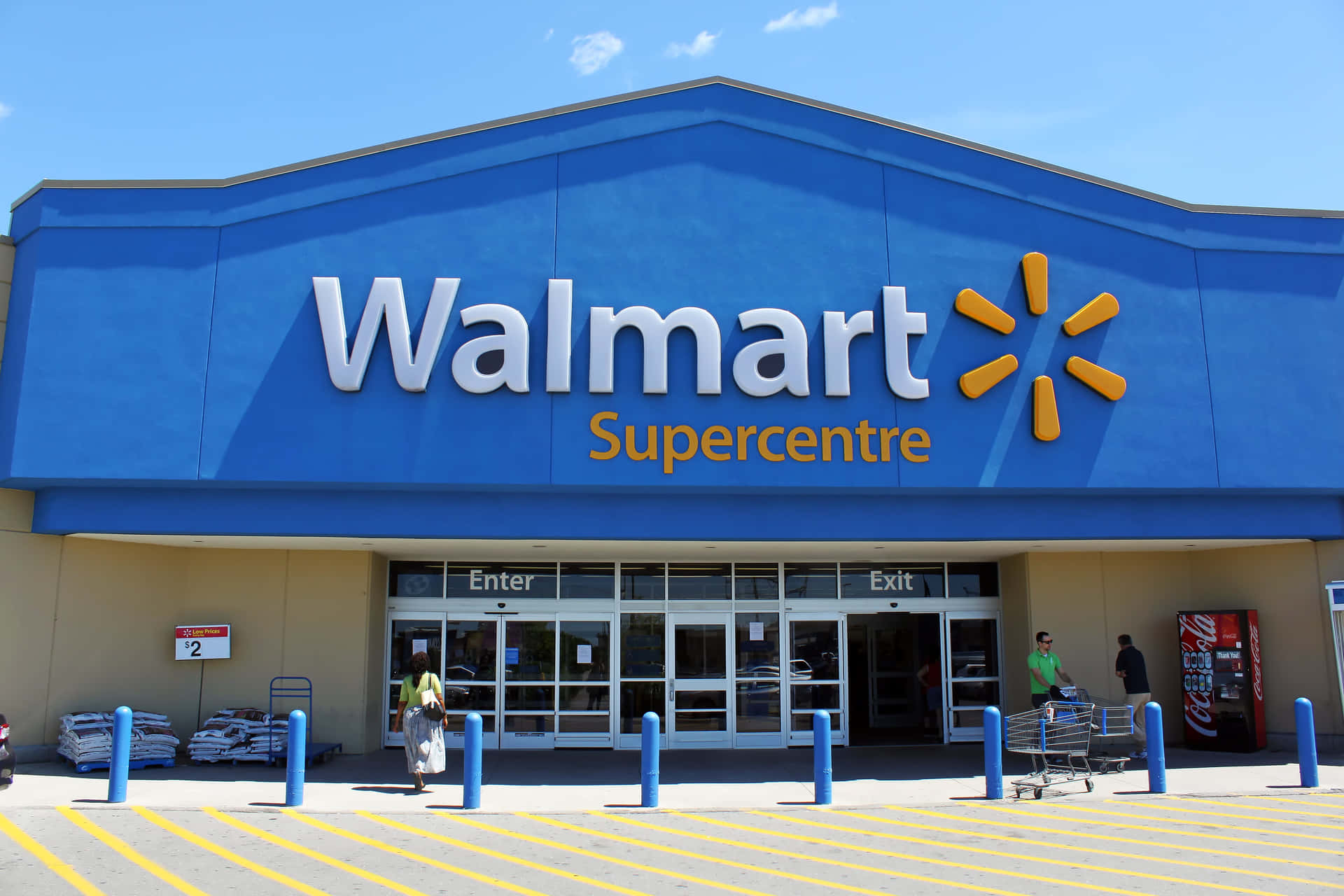 walmart supercentre is a large store with a blue sign