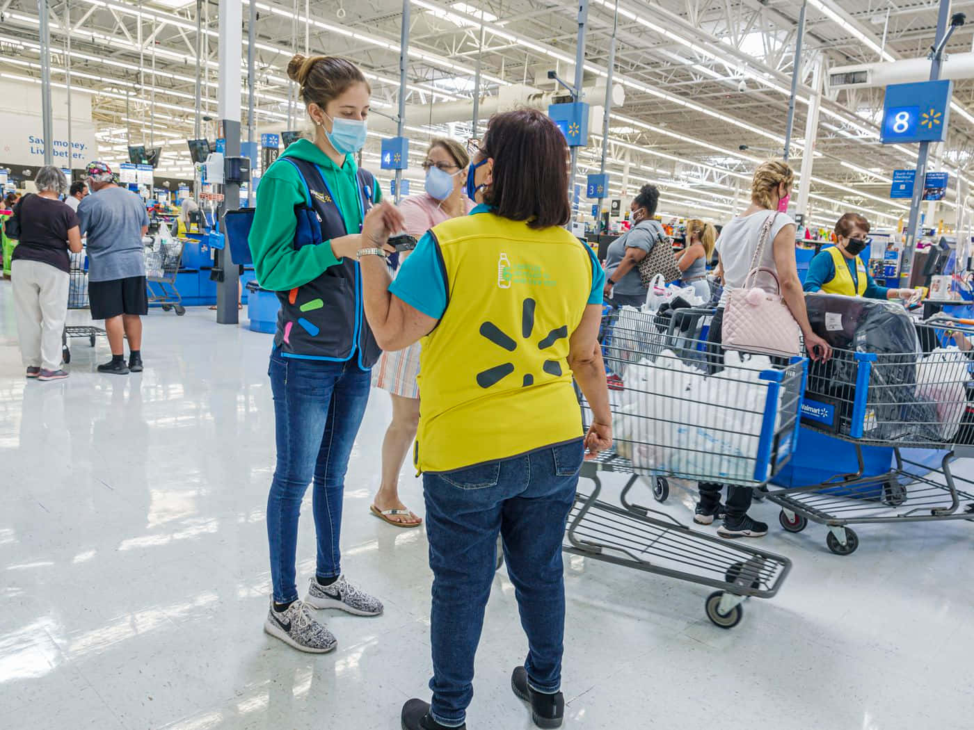 Walmart shoppers searching for their favorite items at a Supercenter location.
