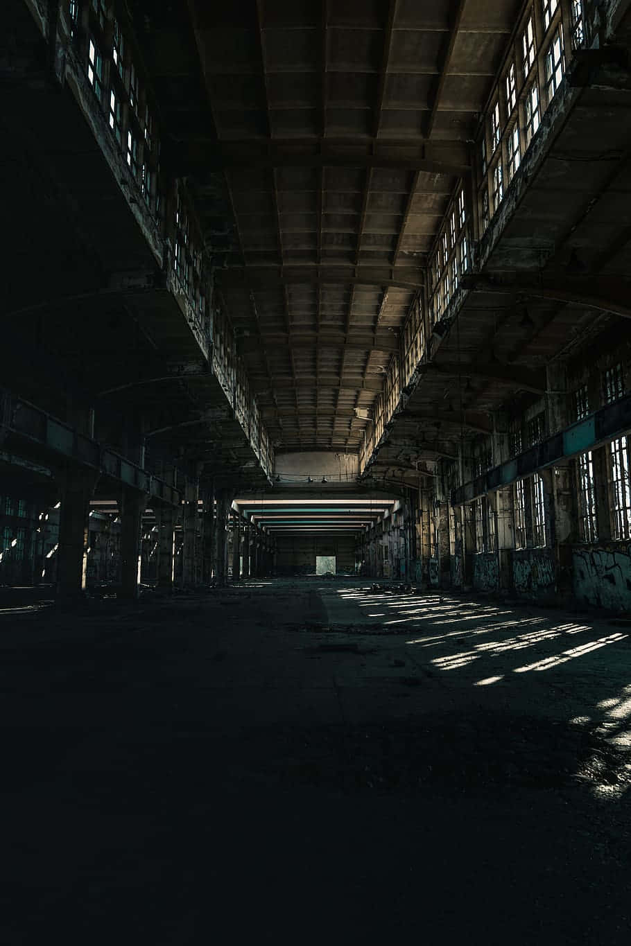 An Empty Warehouse With Windows