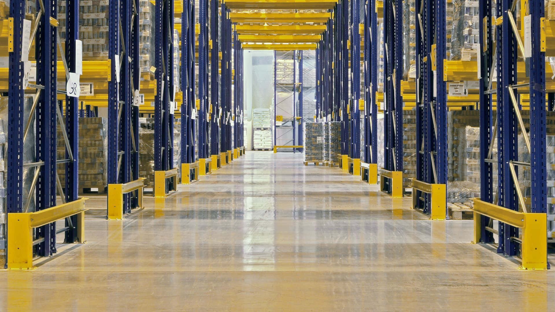 A Warehouse With Yellow And Blue Shelving