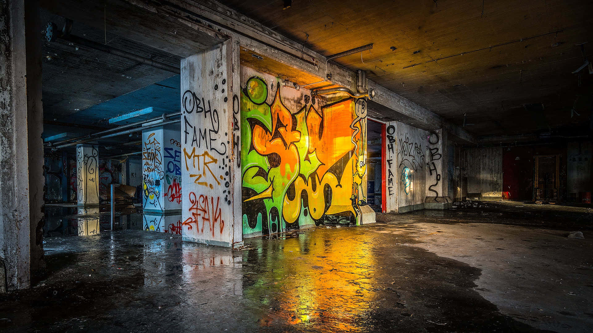 A Building With Graffiti And A Lot Of Water