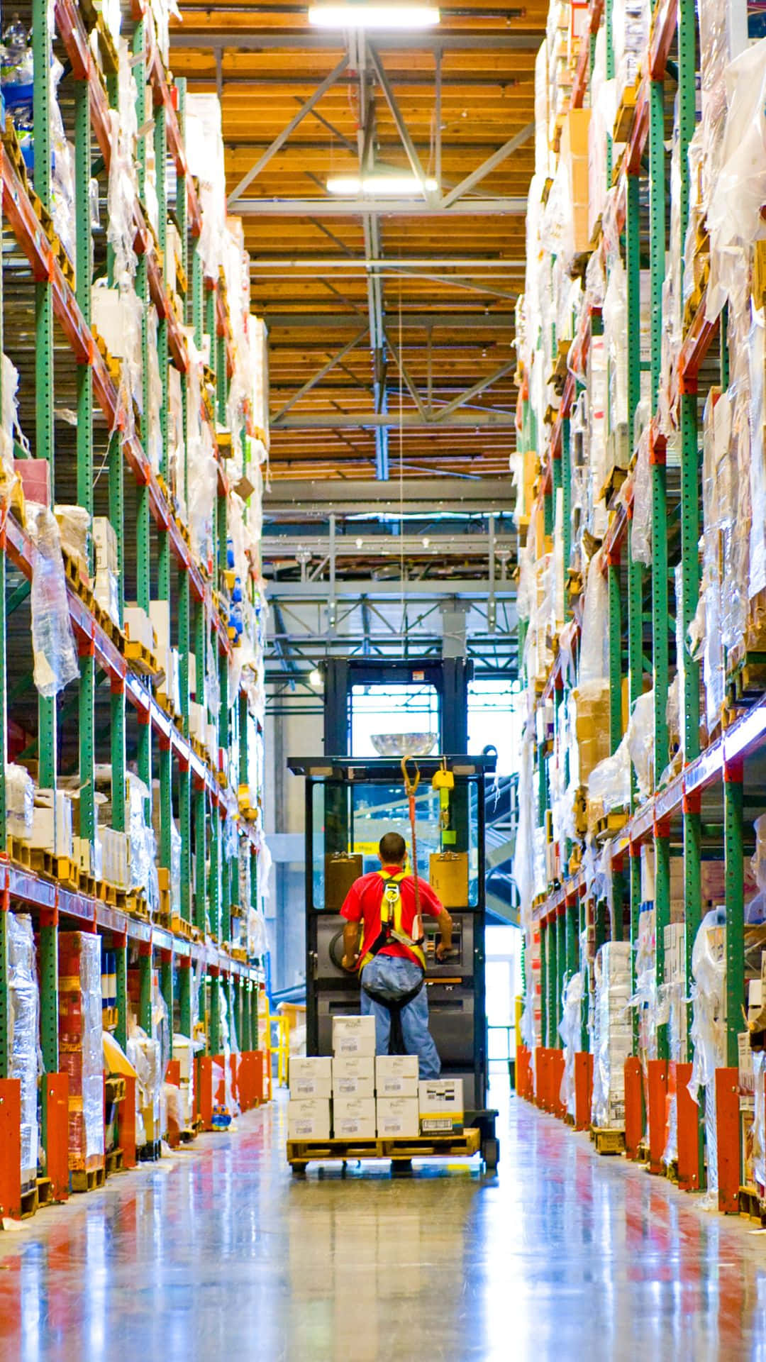 Warehouse Worker Operating Forklift Wallpaper