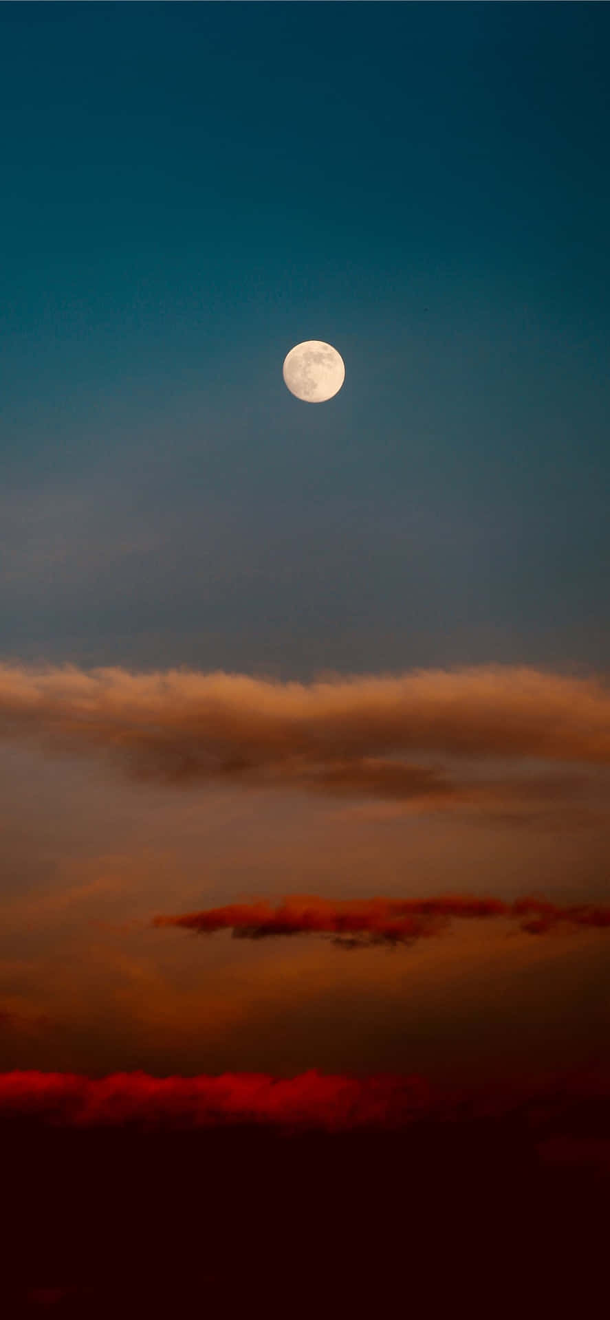 The Moon Is Seen In The Sky Above A Cloudy Sky