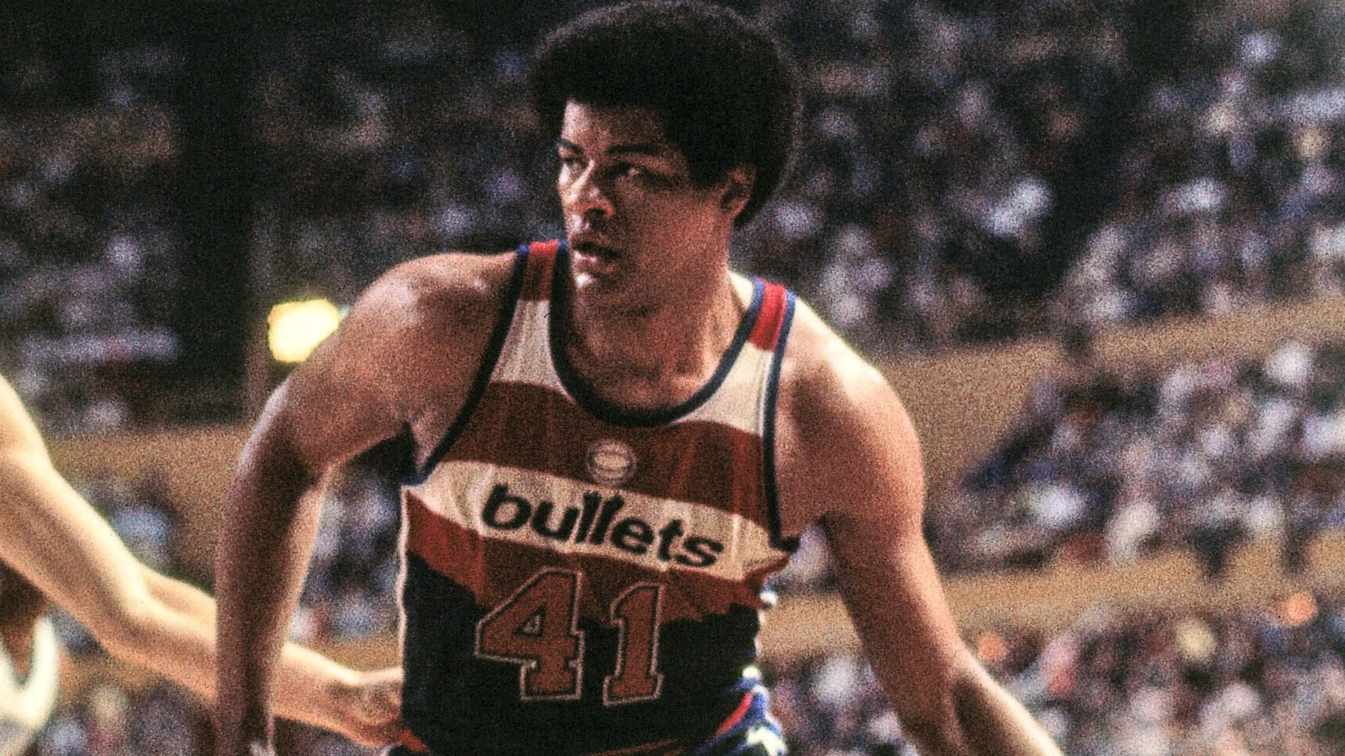 Legendary Washington Bullets Player Wes Unseld in Action Wallpaper
