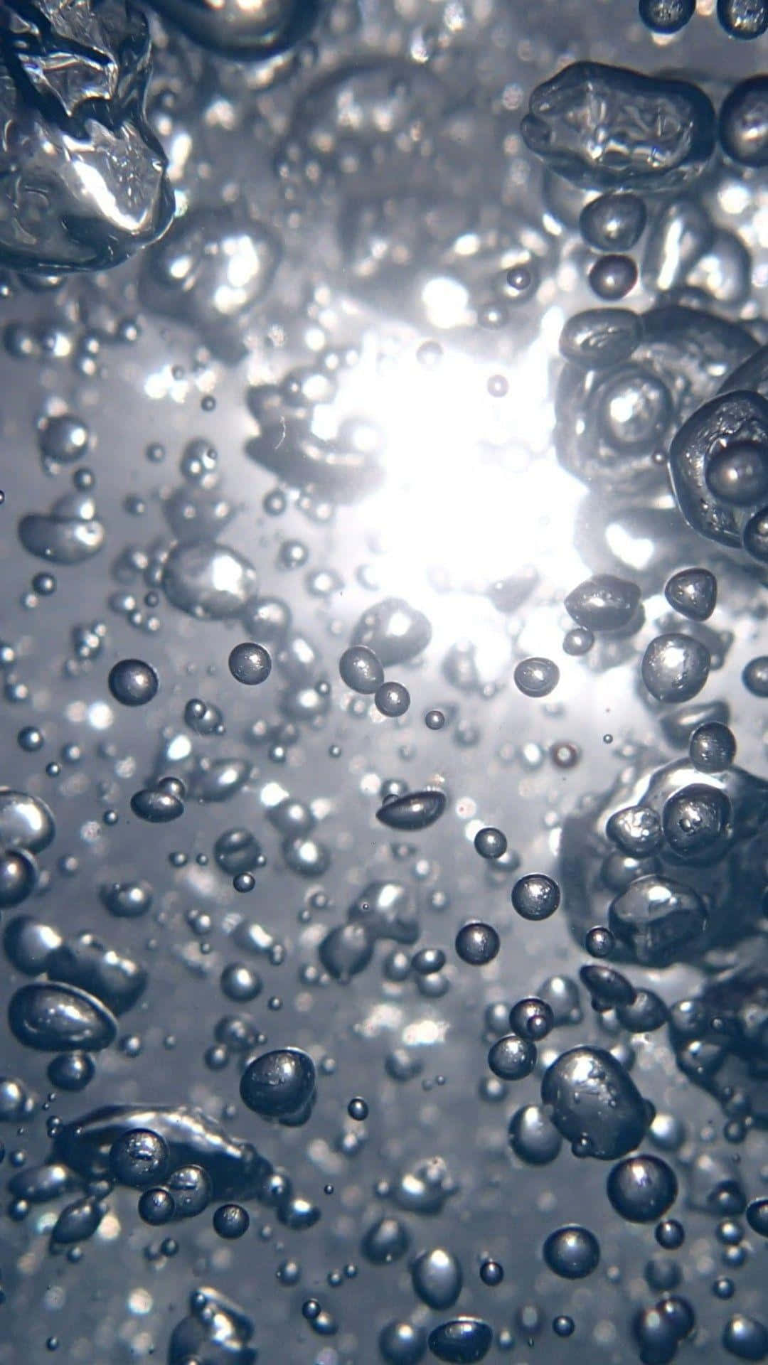“A stunning, glistening droplet of water hangs in the air and captures light like a diamond”