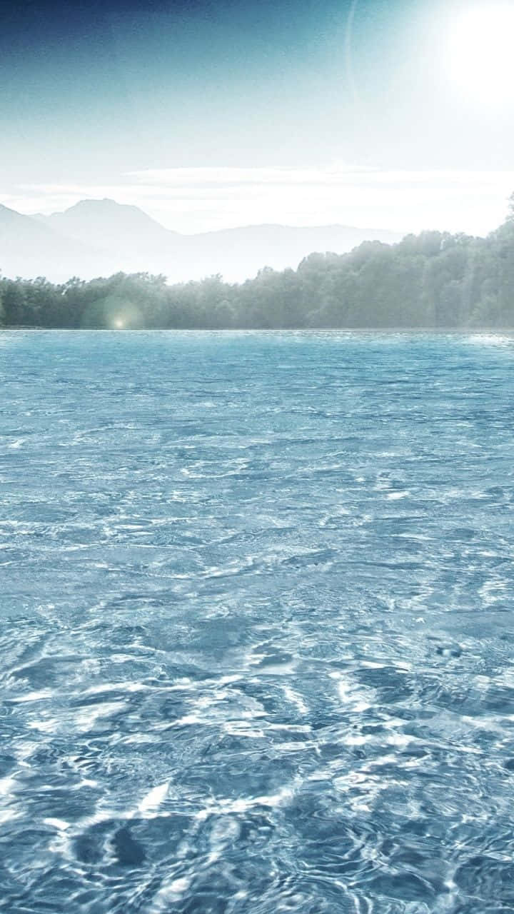 Fördjupadig I Den Perfekta Balansen Mellan Natur Och Teknologi Med Denna Vatten Iphone-bakgrundsbild. Wallpaper