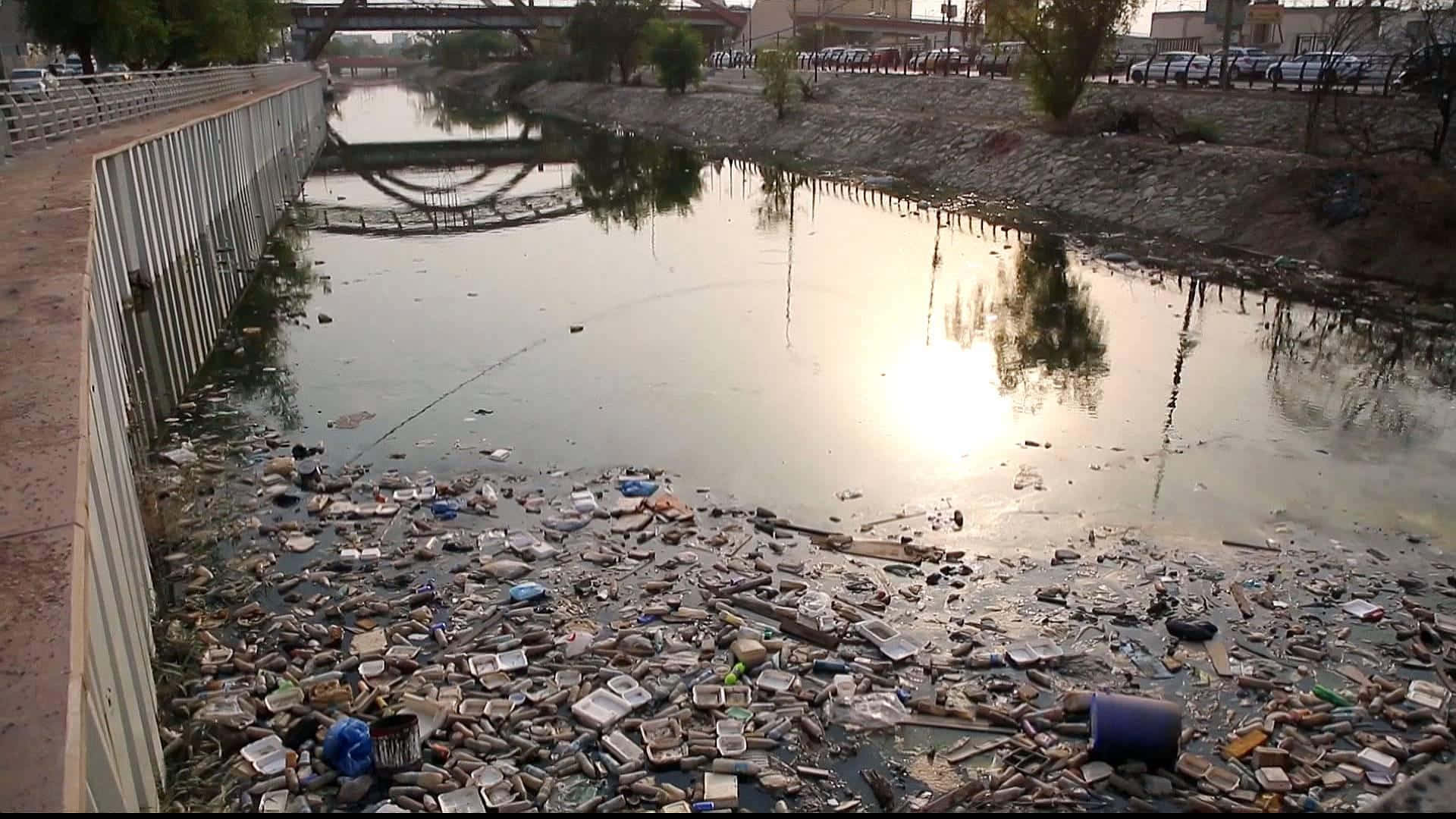 A River With Trash And Garbage In It