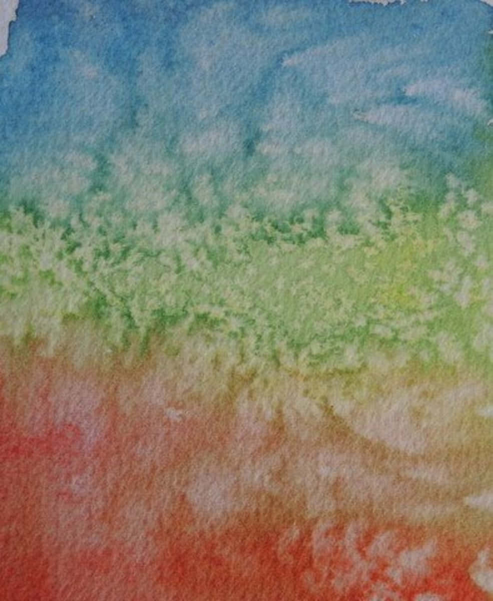 A Watercolor Painting Of A Colorful Sky