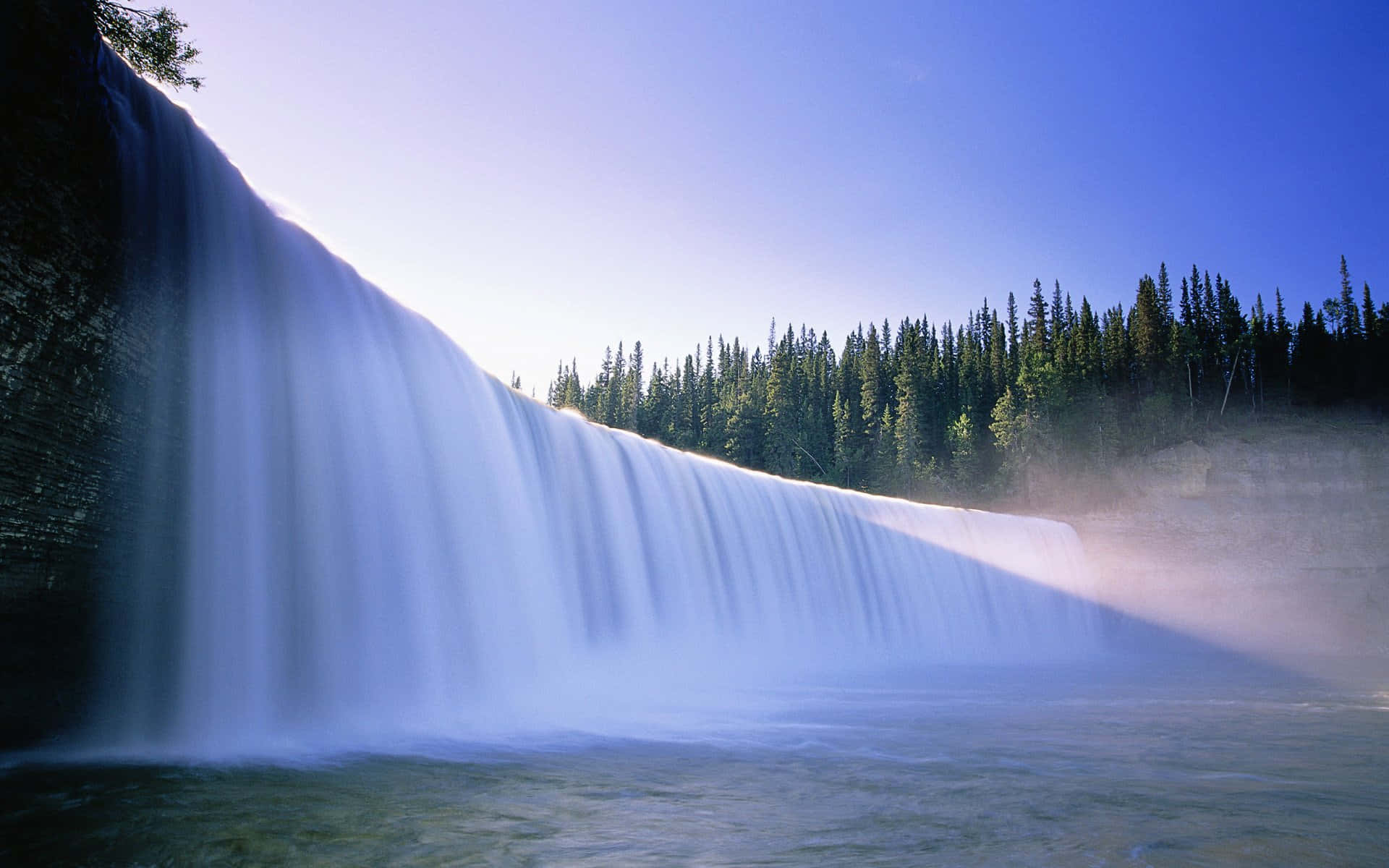 "Witness the mesmerizing majesty of a stunning Waterfall."