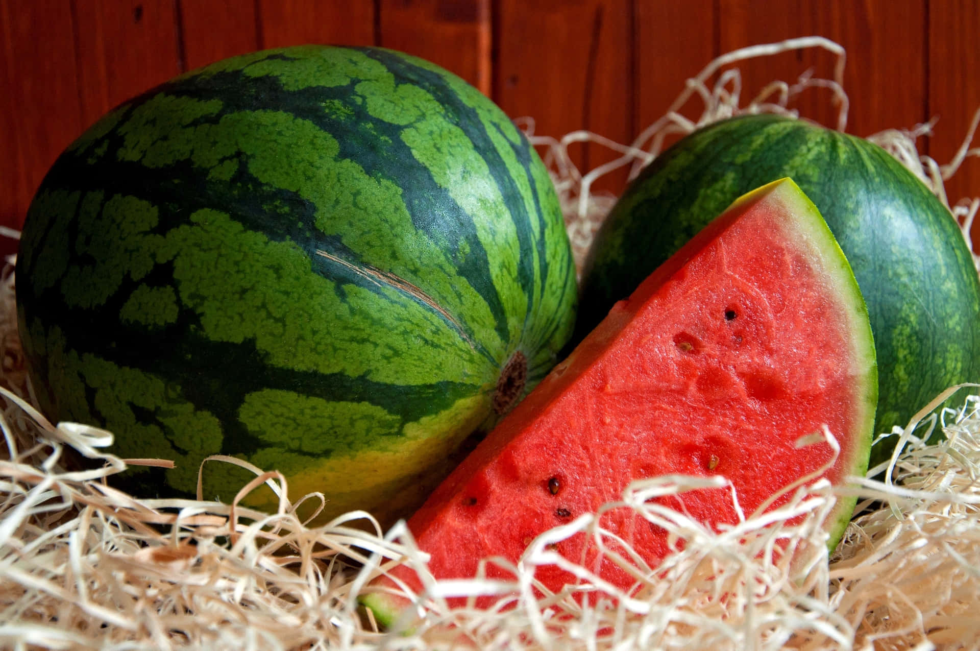 Two Unsliced And Sliced Watermelons Background