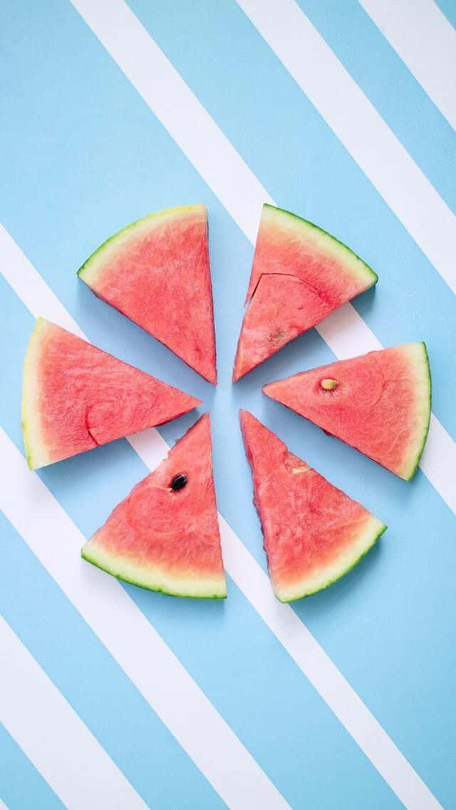 Wassermelonenscheibenauf Einem Blauen Und Weißen Hintergrund Wallpaper