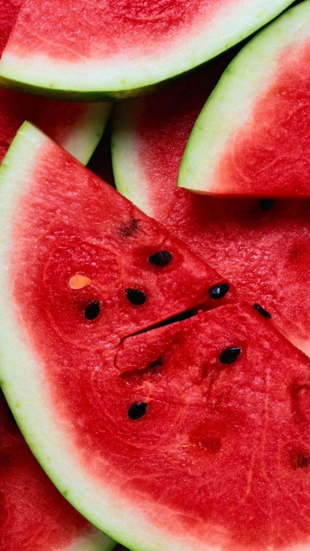 Watermelon Slices Are Arranged In A Close Up Wallpaper