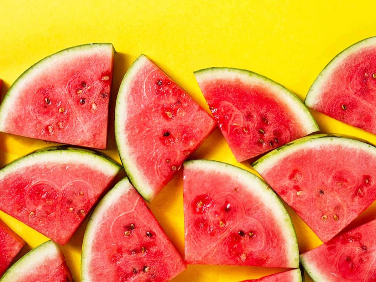 Watermelon Slices On A Yellow Background