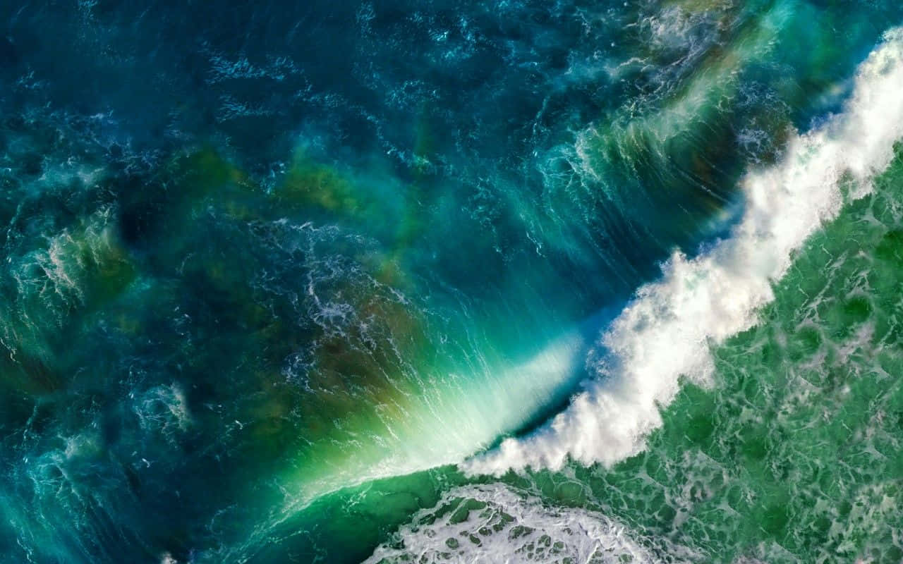 Caption: Powerful waves crashing along the coastline