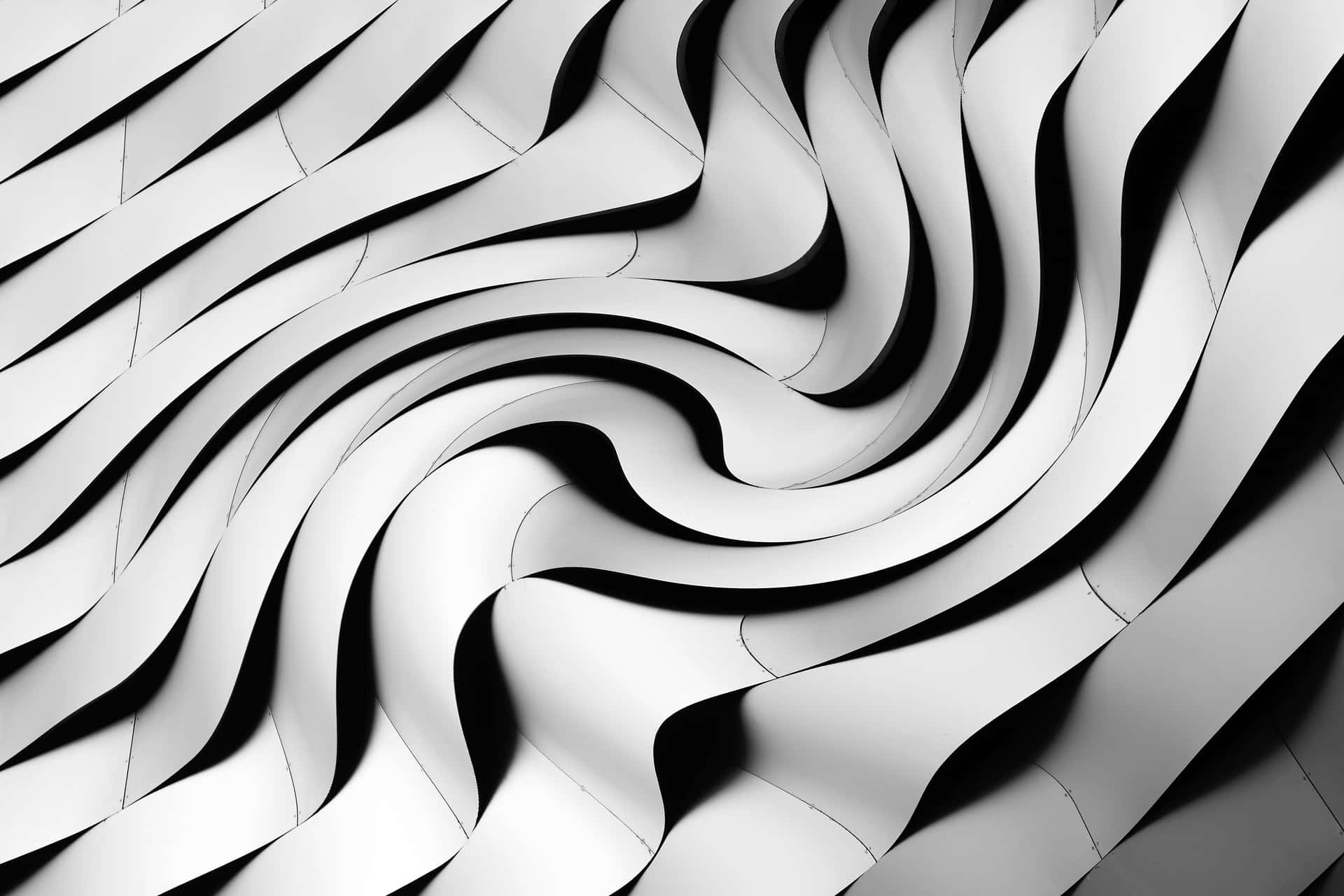 A Black And White Photo Of A Wavy Wall