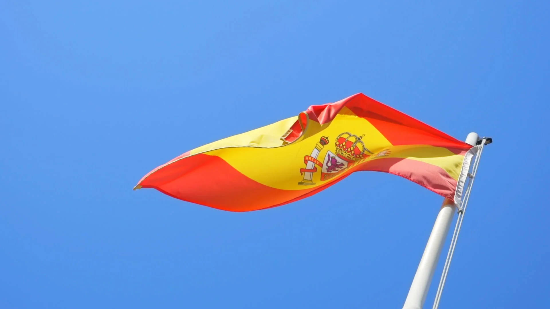 Bølget Spaniens Flag I Pol Wallpaper