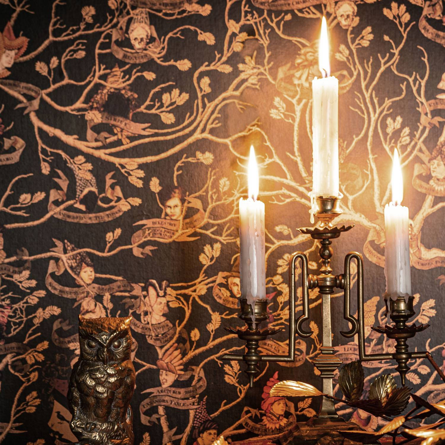 Illuminating Wax Candles on Ornate Candelabra Wallpaper