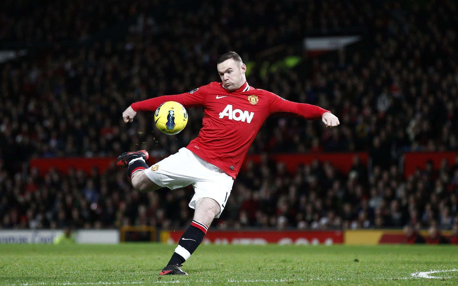 Wayne Rooney Kicks The Ball During A Game