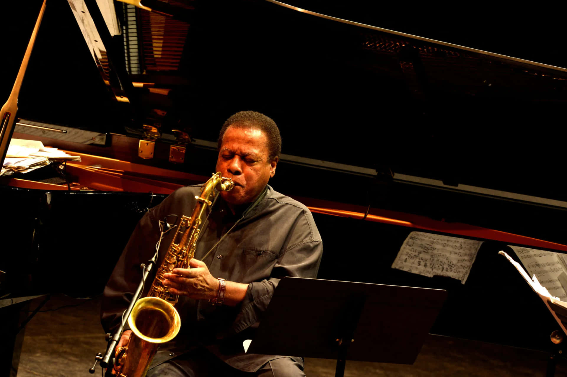 Wayne Shorter on stage during a performance Wallpaper