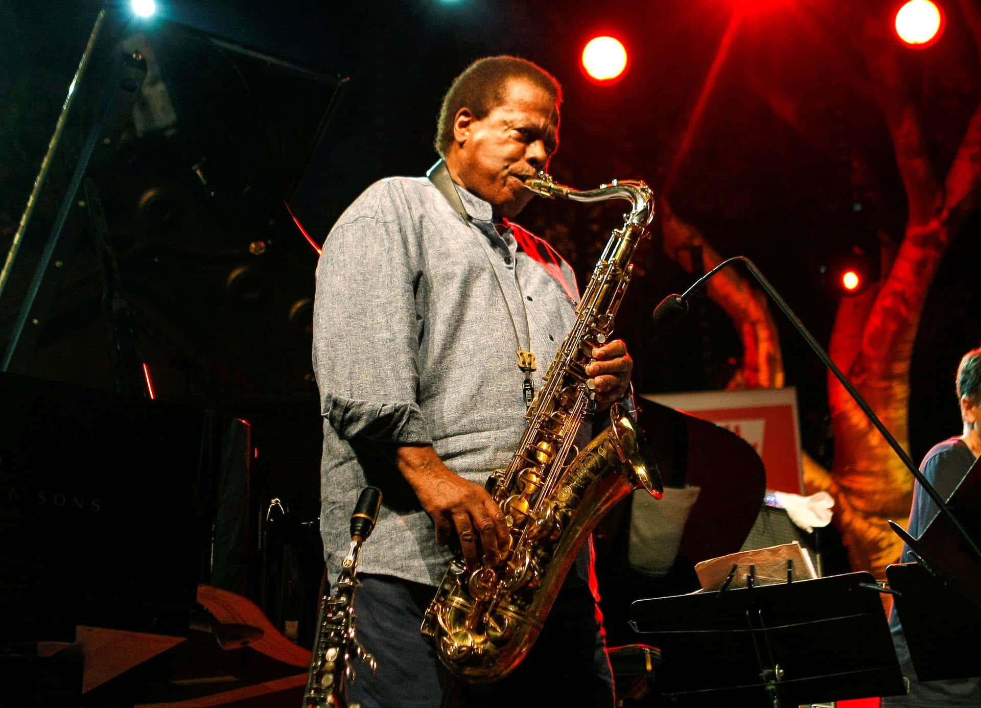 Legendary Jazz Musician Wayne Shorter on Stage Wallpaper