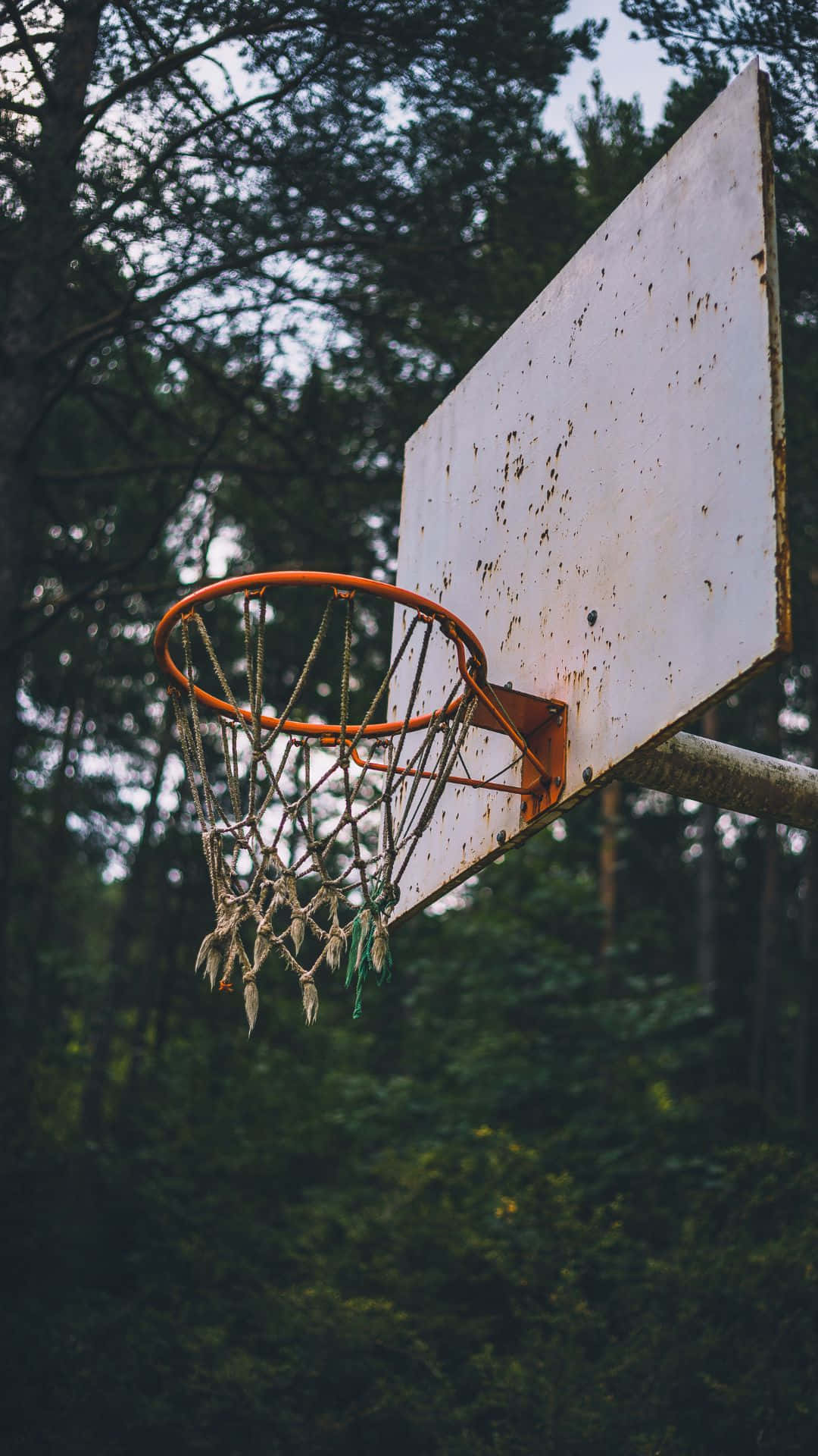 Weathered Outdoor Basketball Hoop Wallpaper
