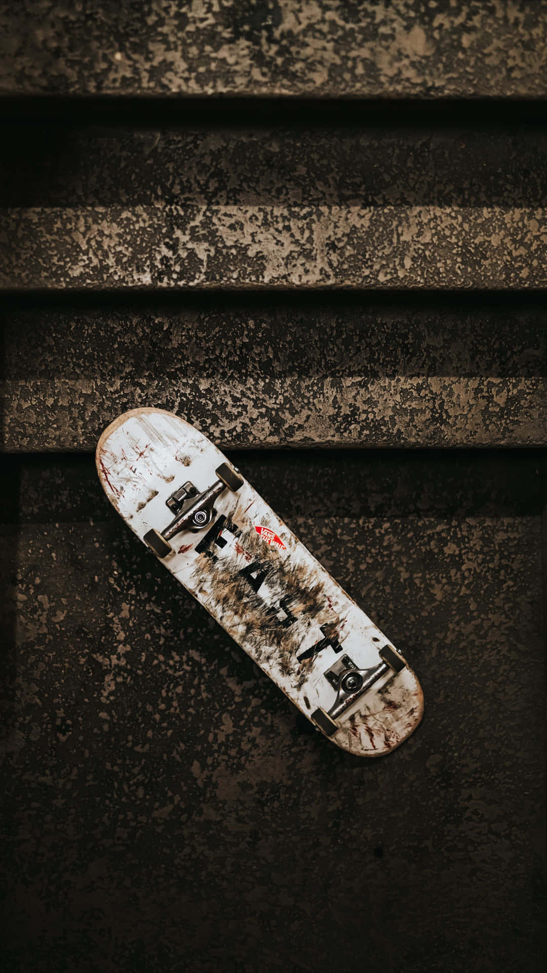 Weathered Skateboardon Stairs Wallpaper