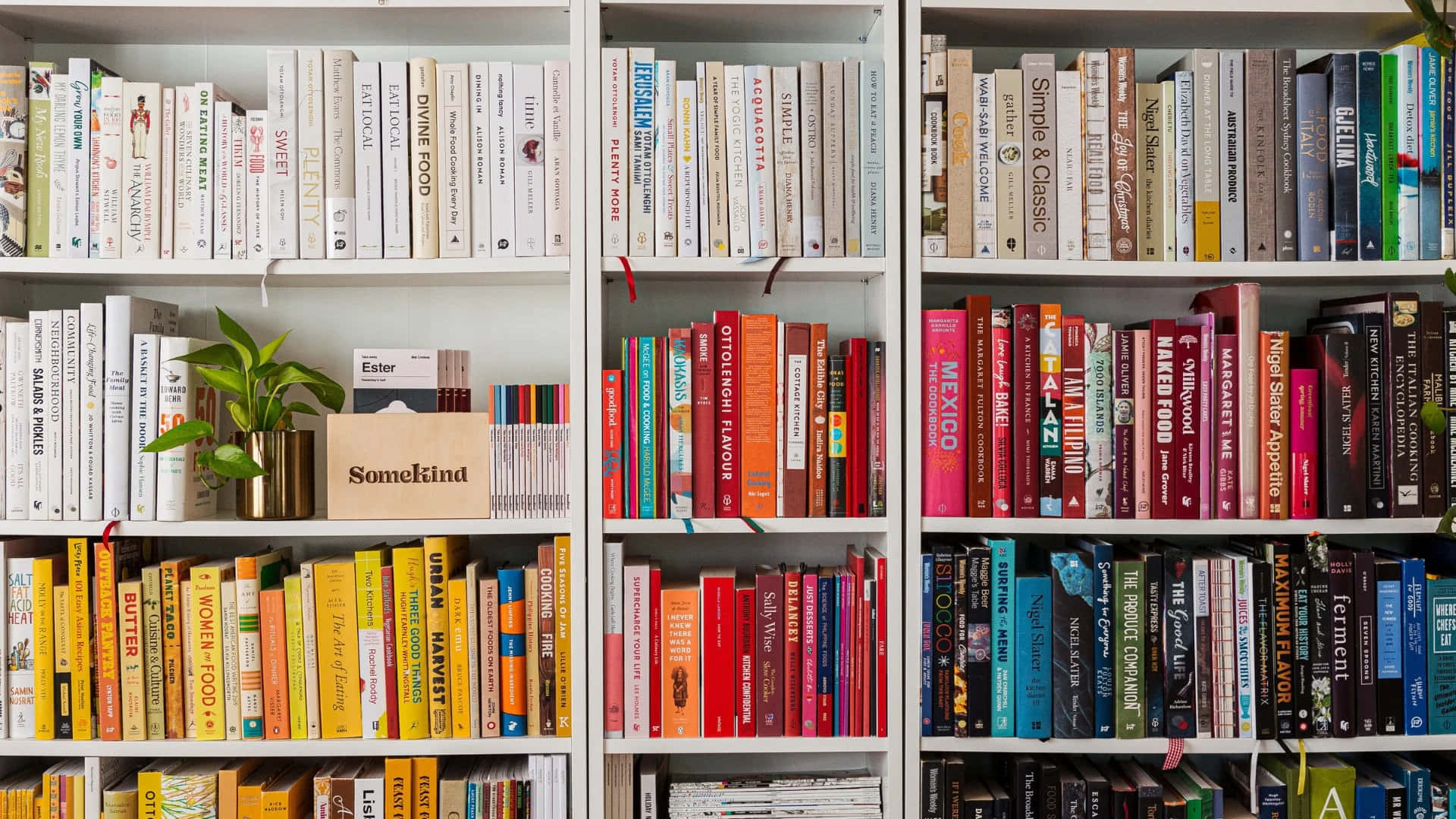 A Book Shelf With Many Books On It