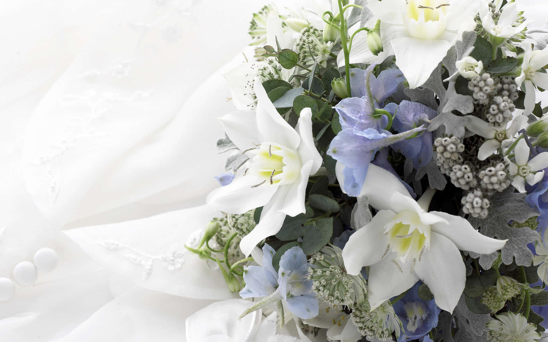A radiant bride holding an elegant wedding bouquet Wallpaper