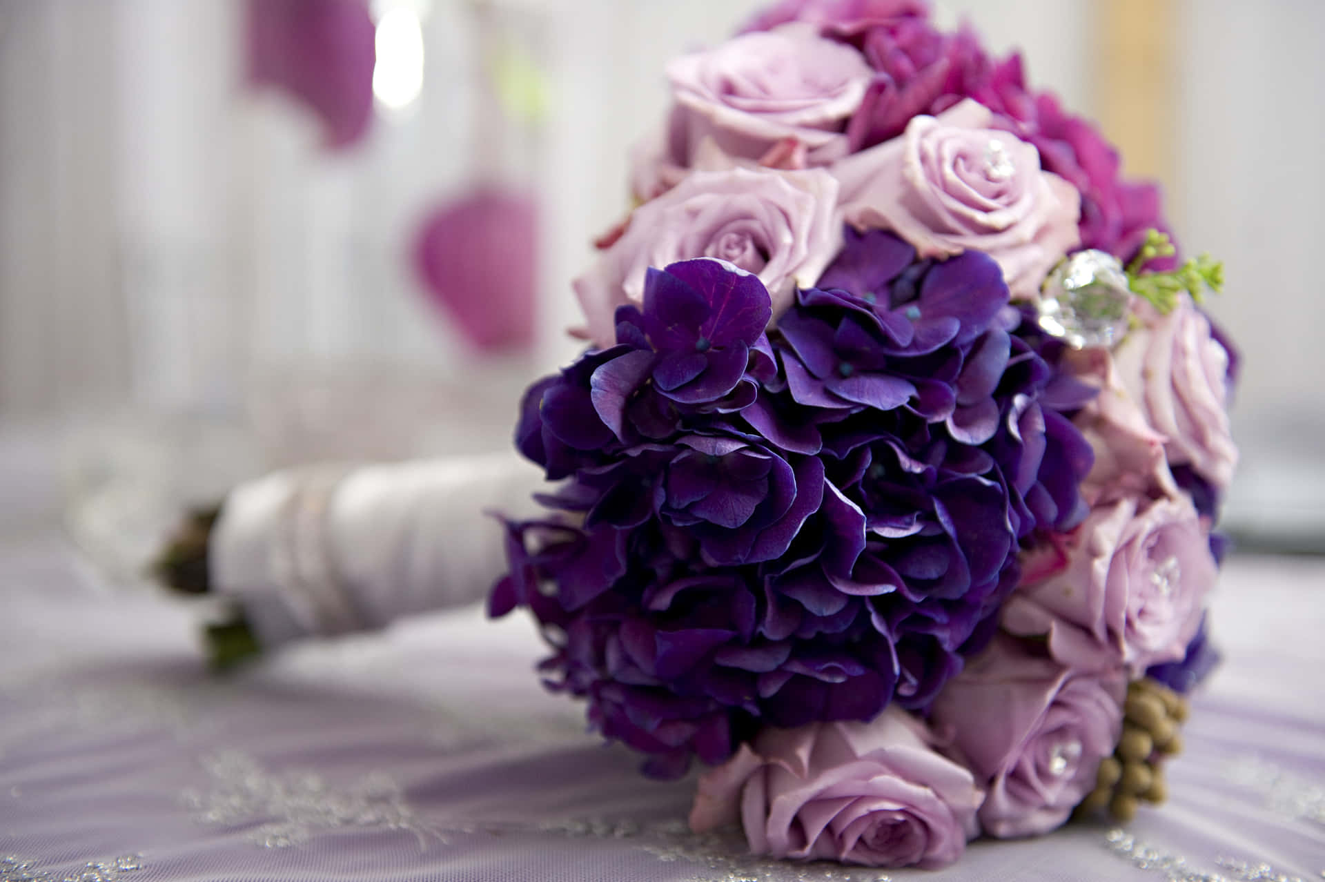 A beautiful and vibrant wedding bouquet resting on a table Wallpaper