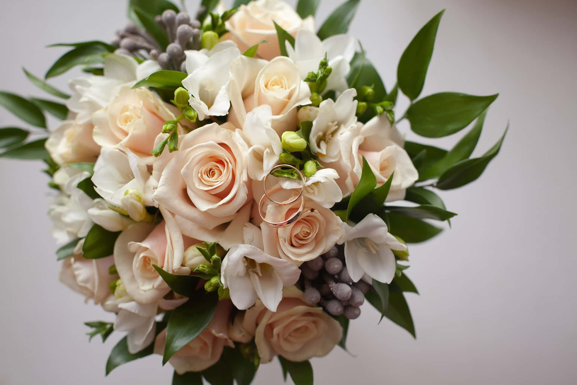 Elegant Wedding Bouquet with Vibrant Blooms and Greenery Wallpaper