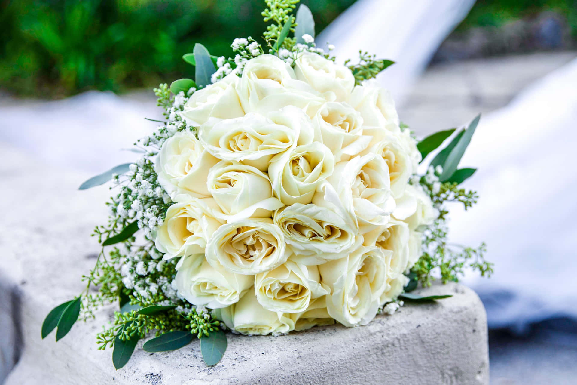 Elegant Bridal Bouquet with White Roses and Greenery Wallpaper