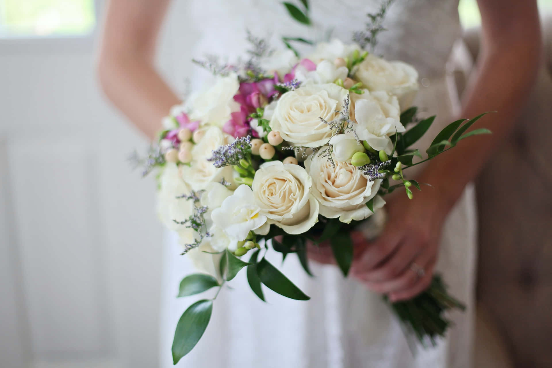 Elegant Wedding Bouquet with Vibrant Flowers Wallpaper
