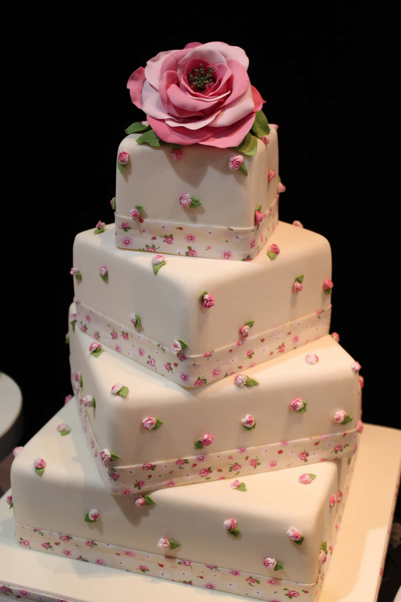 A White Cake With Pink Roses