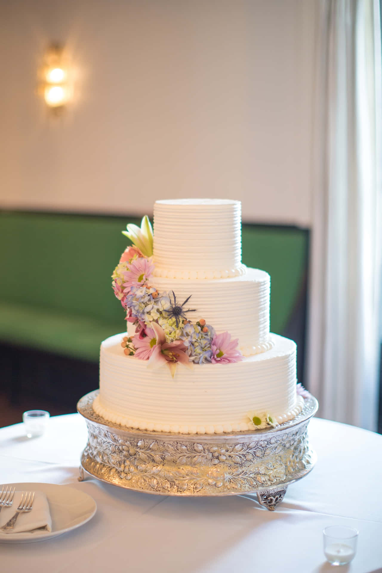 A White Wedding Cake On A Table