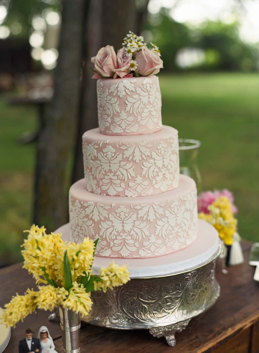 A Pink Wedding Cake On A Table