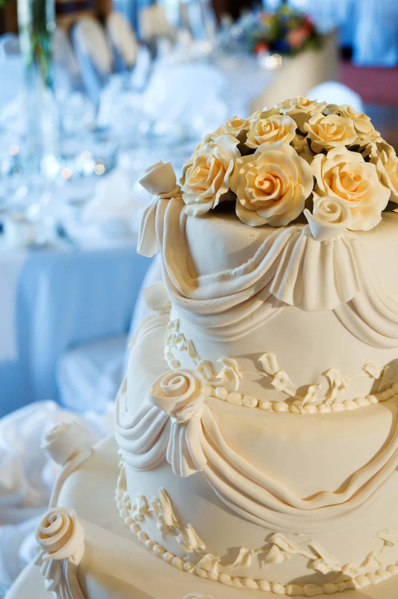 "A beautiful wedding cake topped with stunning flowers, perfect for any wedding!"