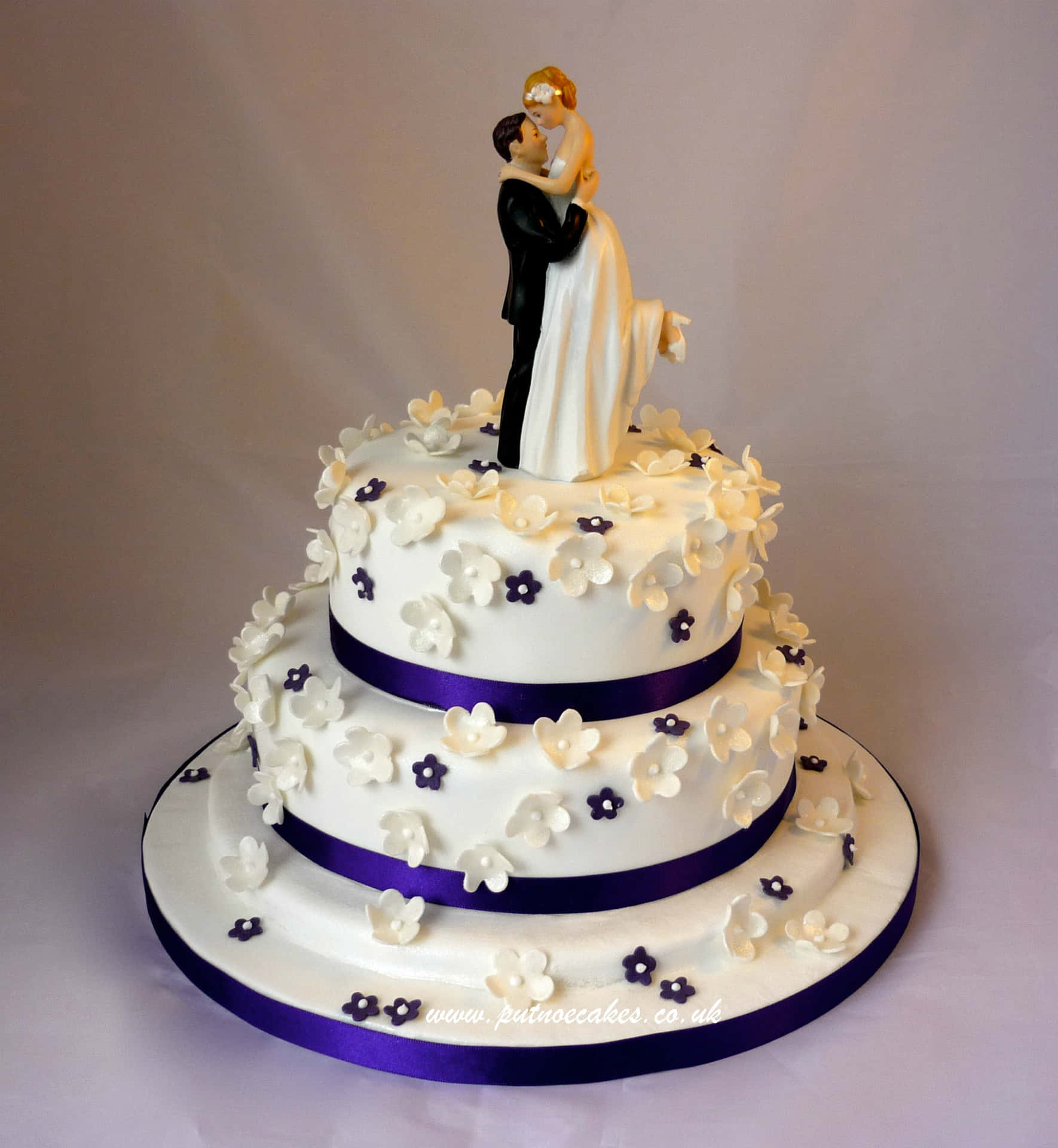 This beautiful tiered wedding cake is the perfect addition to any wedding celebration.