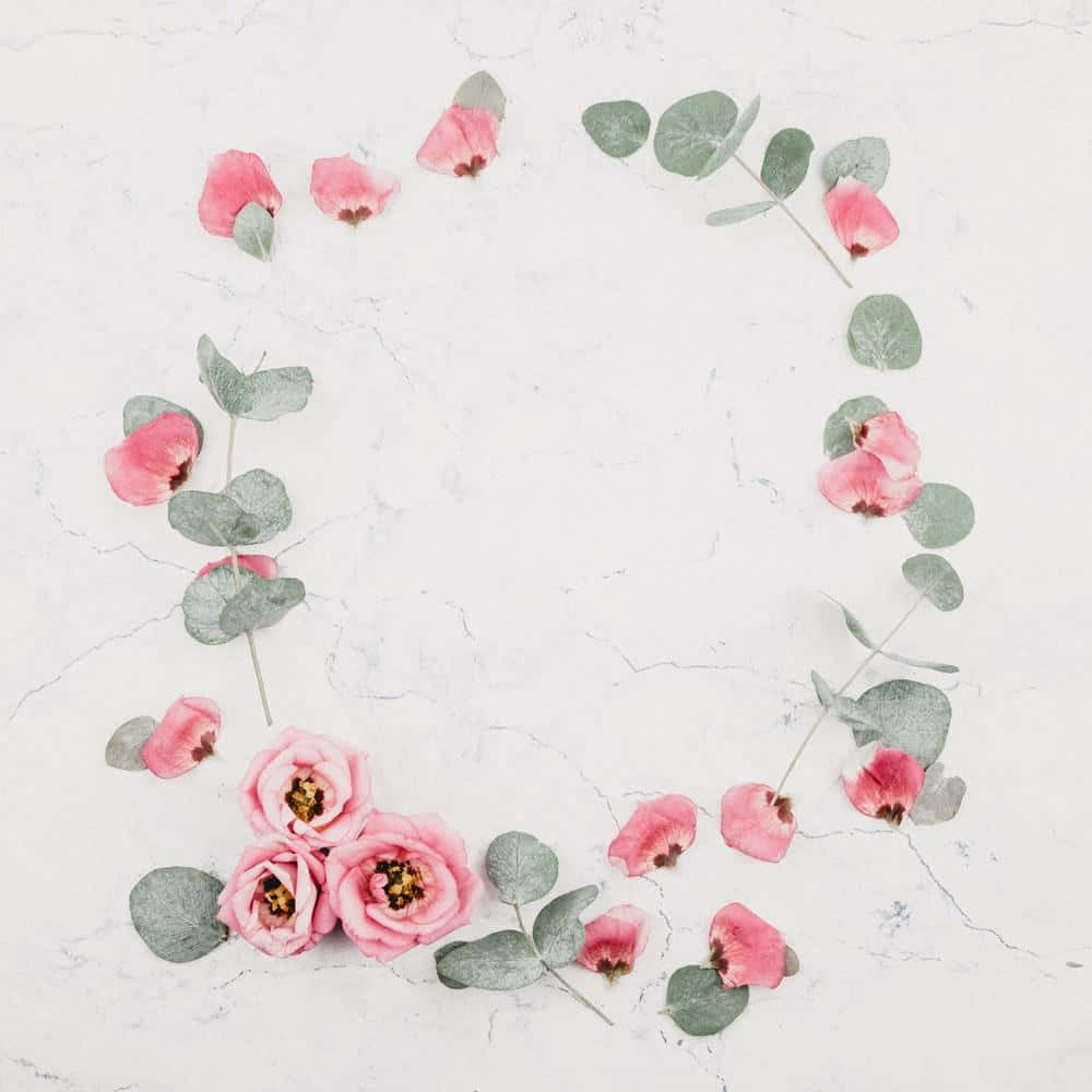 A Pink Flower Arrangement On A Marble Surface