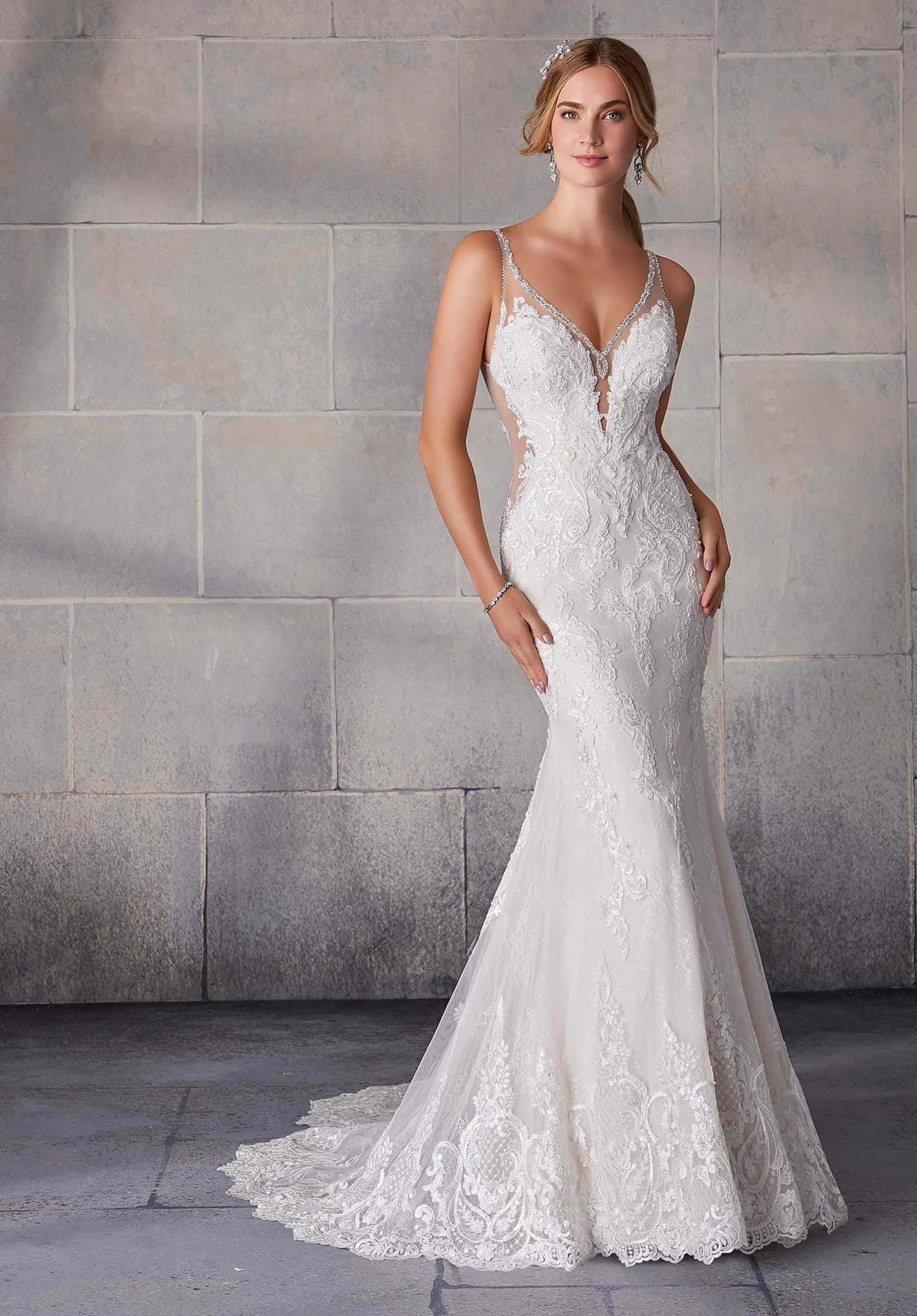 A Mermaid Wedding Dress With A Lace Overlay And A V Neck