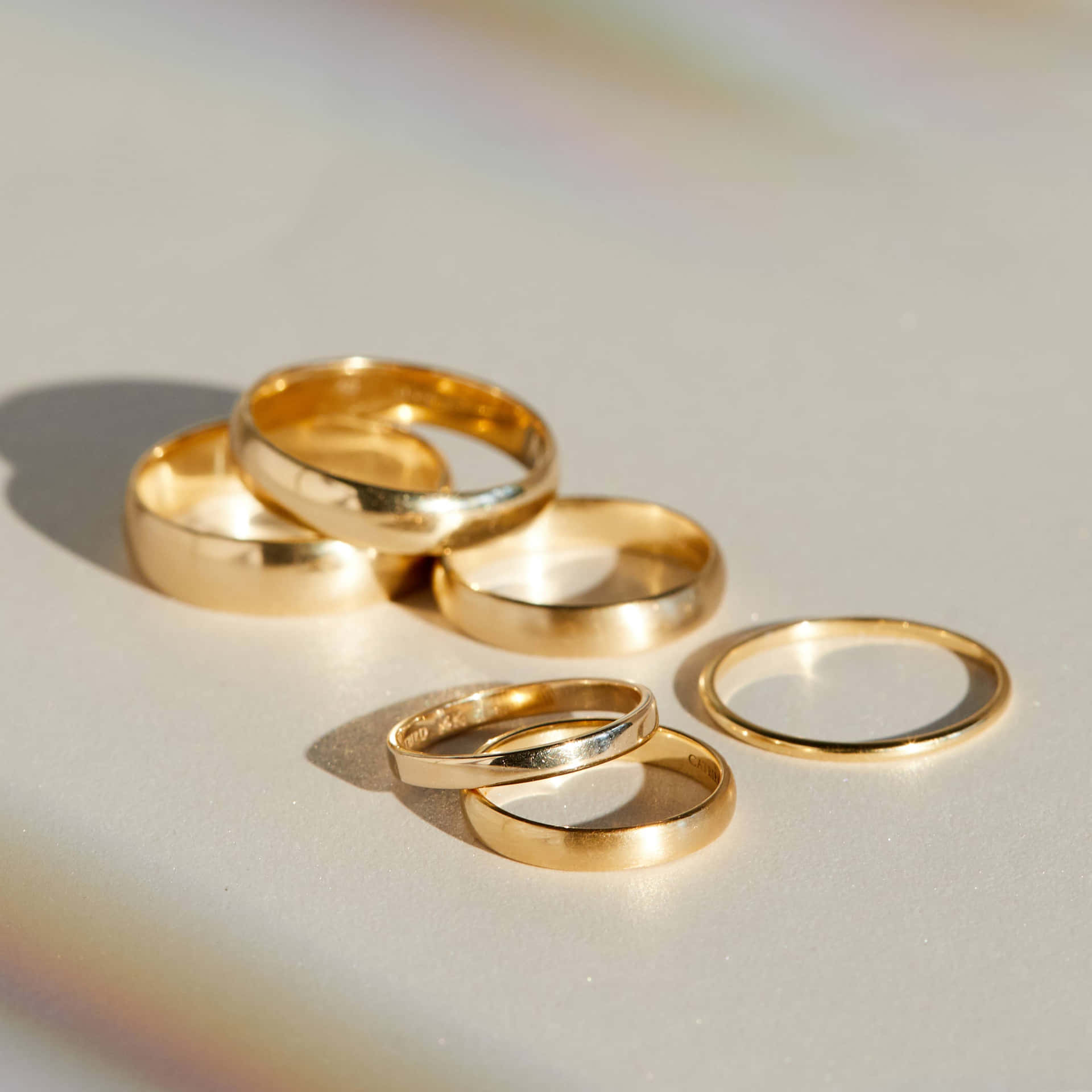 Two delicate gold wedding rings ready to be placed on happy future spouses