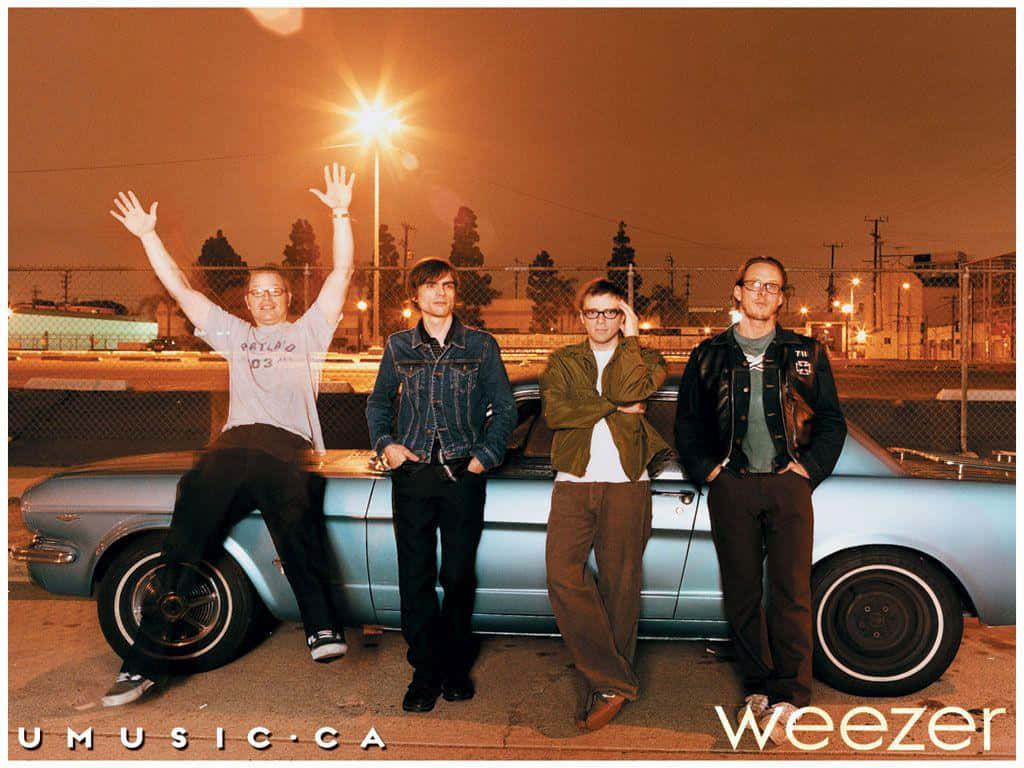 Download Weezer Band Nighttime Car Photoshoot Wallpaper | Wallpapers.com