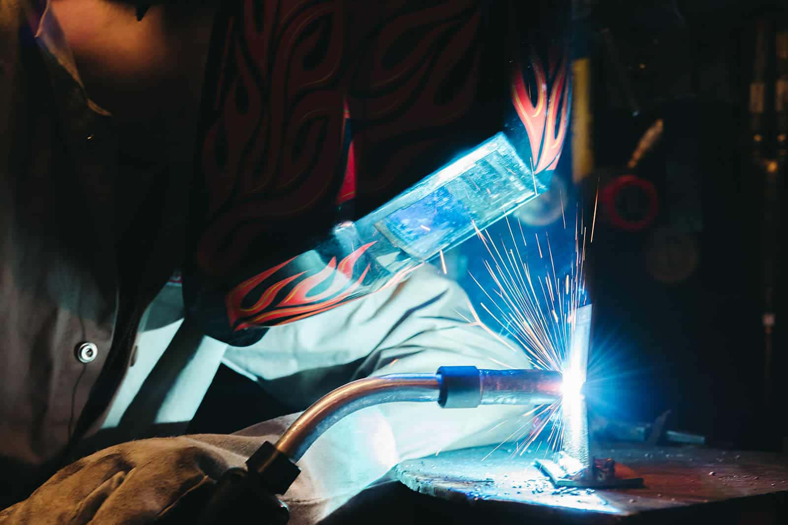 A Person Welding With A Torch Wallpaper