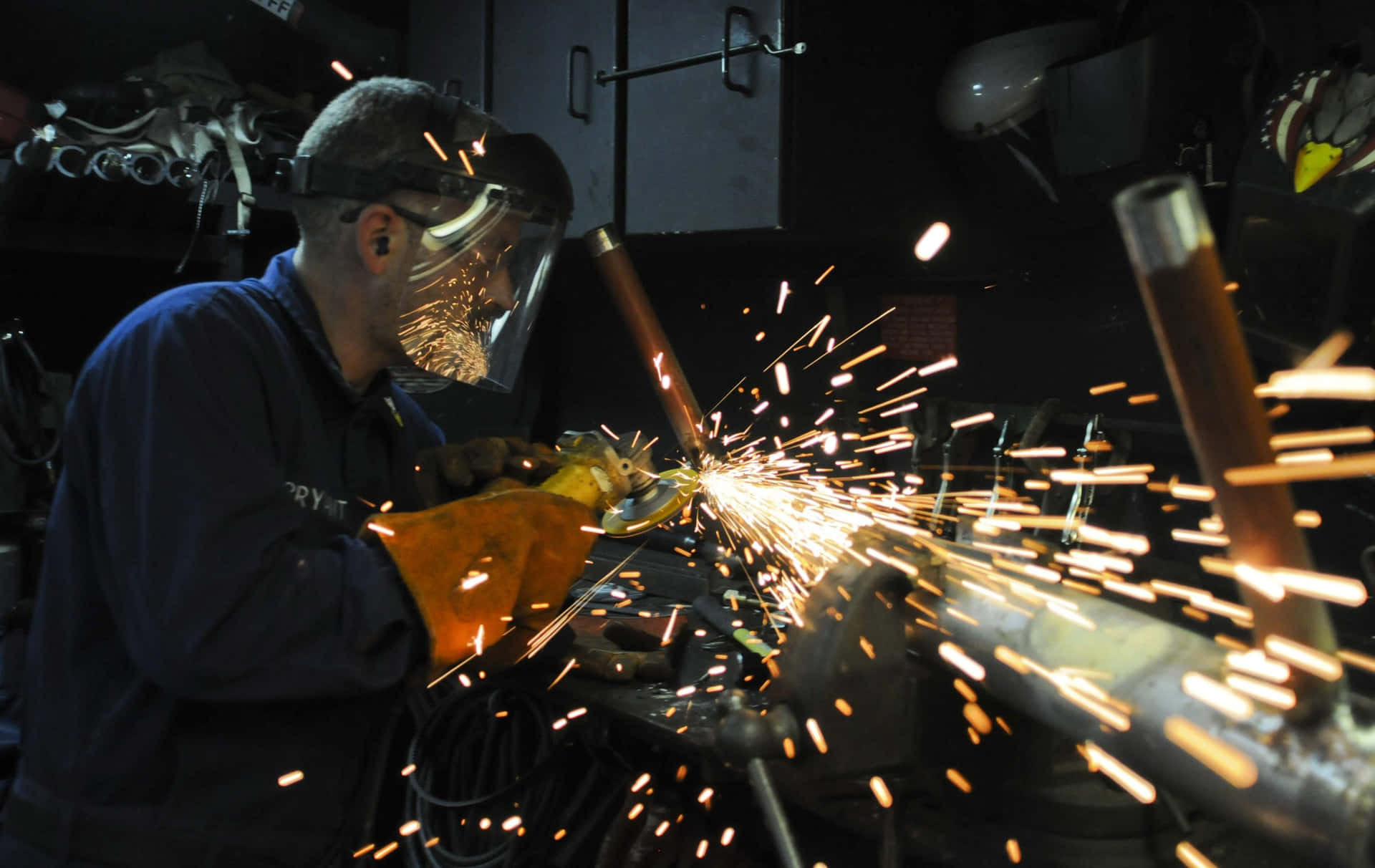 Sparks Fly as Skilled Welder Perfects Welds Wallpaper