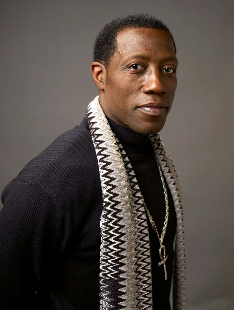 Wesley Snipes exuding confidence in an intense portrait Wallpaper