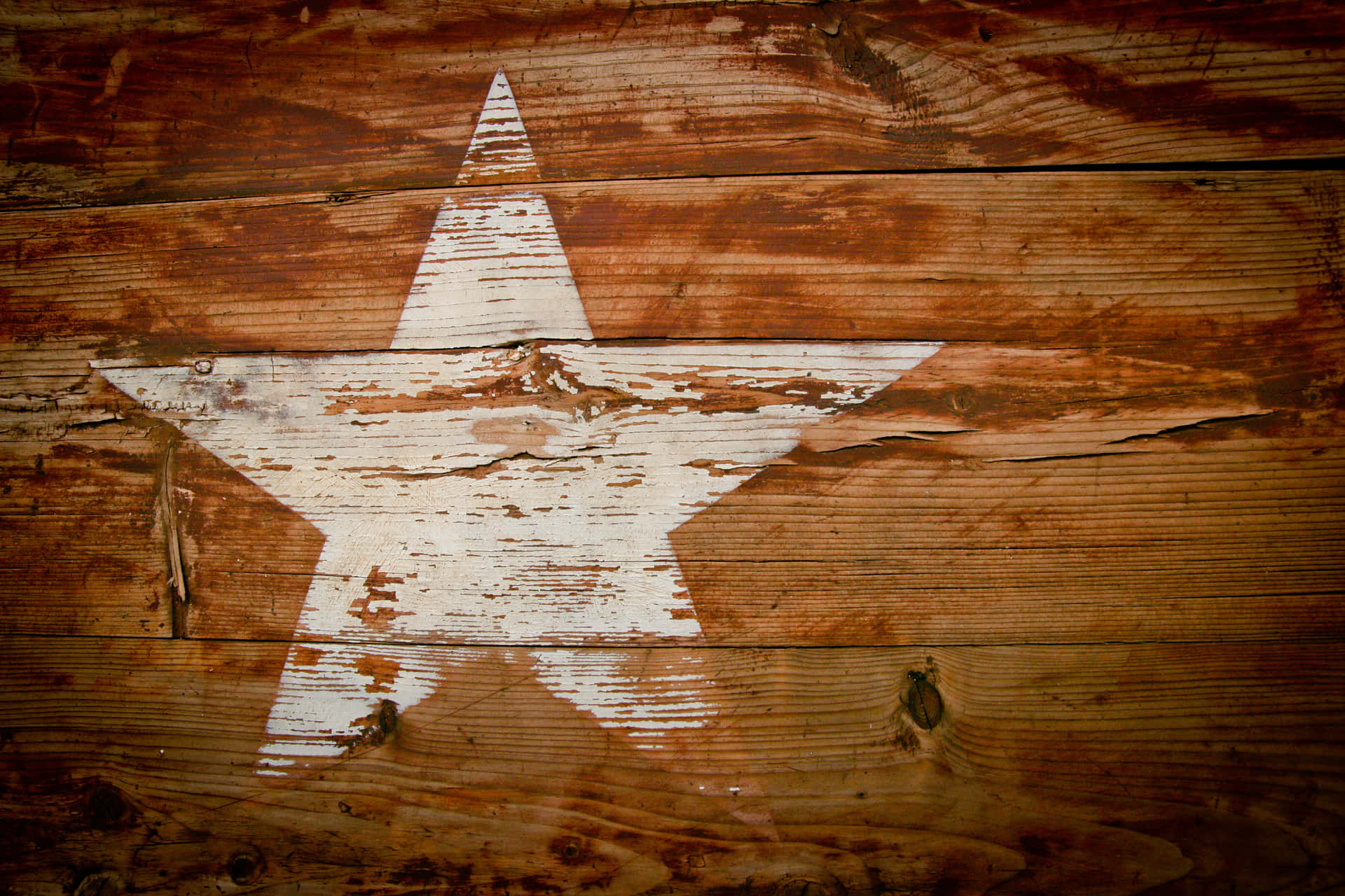 A White Star Painted On A Wooden Wall