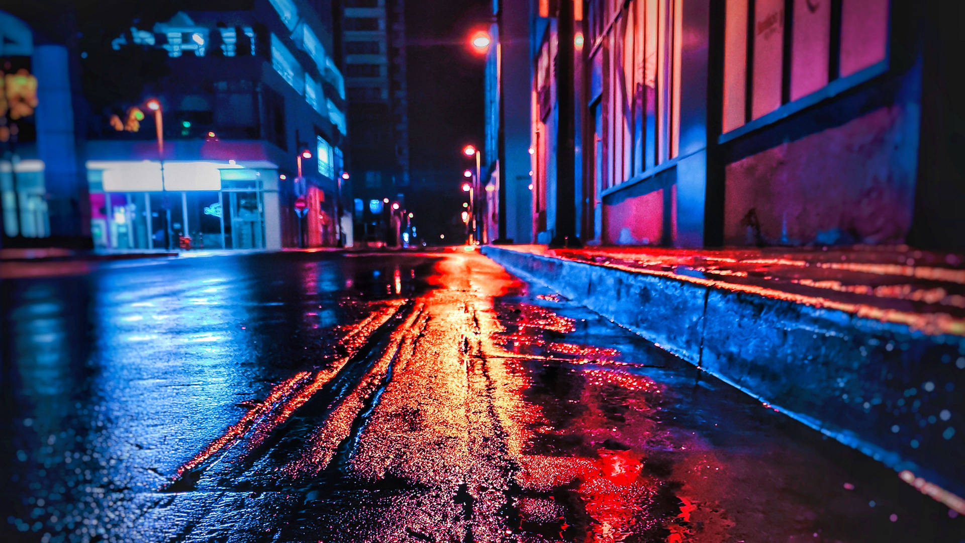 Wet Concrete Road In City At Night Wallpaper