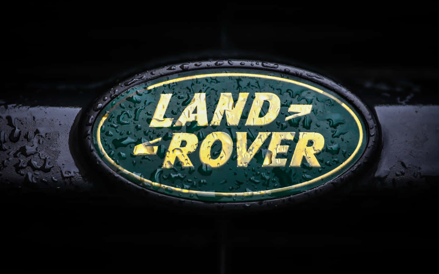 Wet Land Rover Badge Closeup Wallpaper